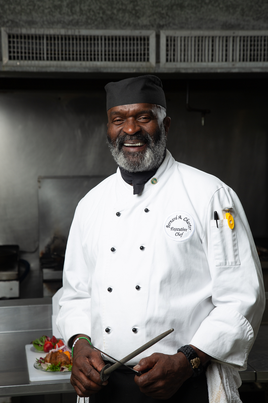Chef Bernard Presenting a Dish